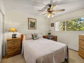 This cozy bedroom offers a serene retreat with its warm, inviting ambiance.