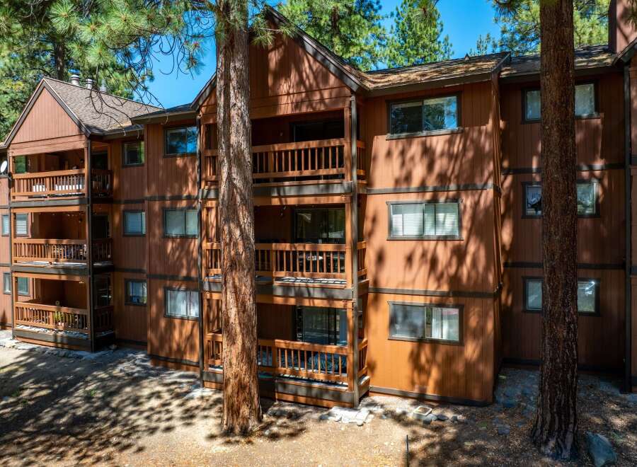Discover the charm of this stunning multi-story property, featuring spacious balconies and a warm, inviting exterior.