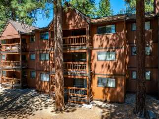 Discover the charm of this stunning multi-story property, featuring spacious balconies and a warm, inviting exterior.