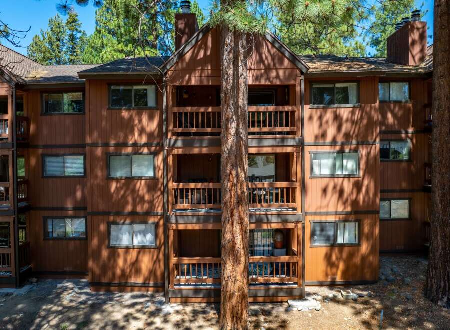 Discover the charm of this stunning multi-story property, featuring spacious balconies and a warm, inviting exterior.