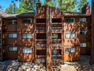 Discover the charm of this stunning multi-story property, featuring spacious balconies and a warm, inviting exterior.