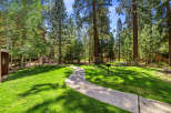 Discover the tranquility of this stunning property, nestled amidst lush greenery and towering trees.