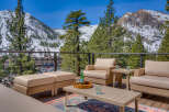 Enjoy breathtaking mountain views from this luxurious outdoor living space.