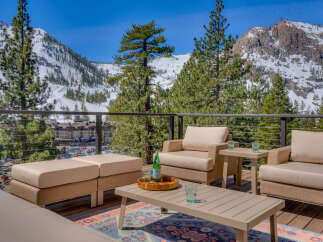 Enjoy breathtaking mountain views from this luxurious outdoor living space.