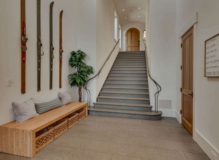Step into this inviting entryway, showcasing a blend of rustic charm and modern elegance.