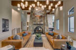 Experience luxury living in this stunning property featuring a grand stone fireplace, perfect for cozy evenings.