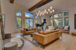 Experience luxury living in this stunning property featuring a spacious living room with breathtaking mountain views.
