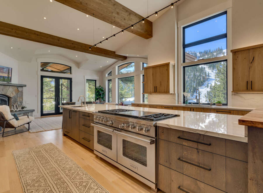 This stunning kitchen boasts a modern design with high-end appliances and ample counter space, perfect for culinary enthusiasts.