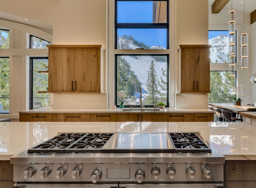 This stunning kitchen boasts a modern design with high-end appliances and custom cabinetry.