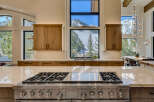 This stunning kitchen boasts a modern design with high-end appliances and custom cabinetry.