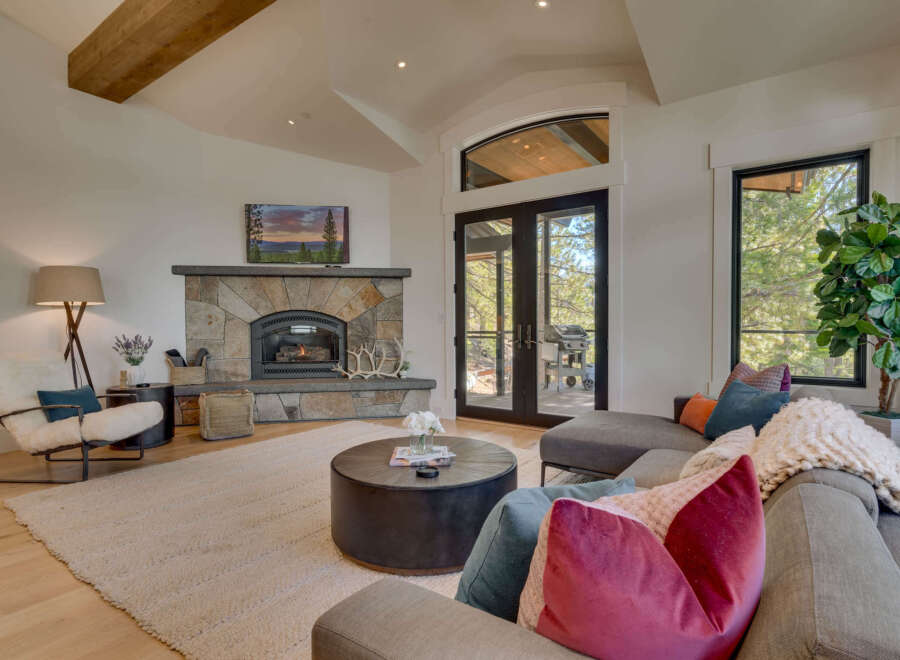 This stunning living room boasts a cozy fireplace, perfect for chilly evenings.