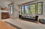 Experience luxury living in this stunning property, featuring a spacious living room with breathtaking mountain views.