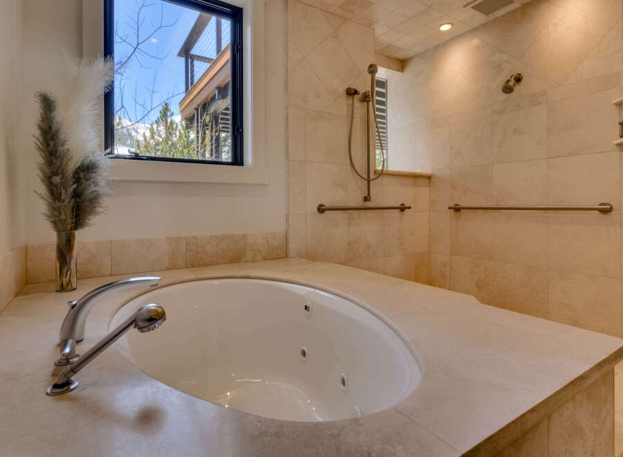 Indulge in luxury with this stunning bathroom featuring a sleek, modern design.