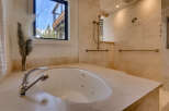 Indulge in luxury with this stunning bathroom featuring a sleek, modern design.