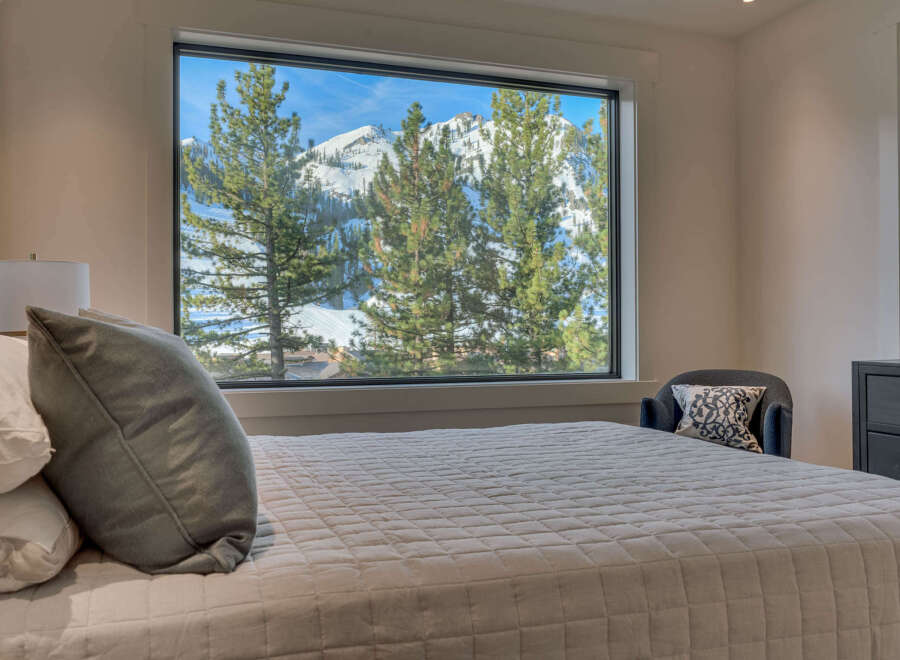 Experience the tranquility of mountain living in this stunning bedroom.