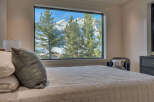 Experience the tranquility of mountain living in this stunning bedroom.