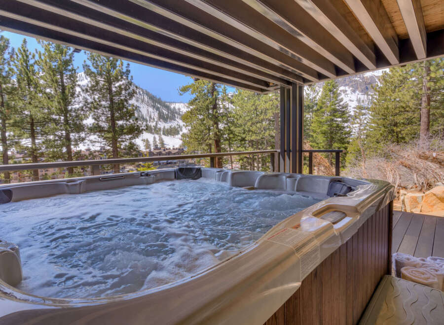 Enjoy the ultimate relaxation in this luxurious property featuring a hot tub with stunning mountain views.