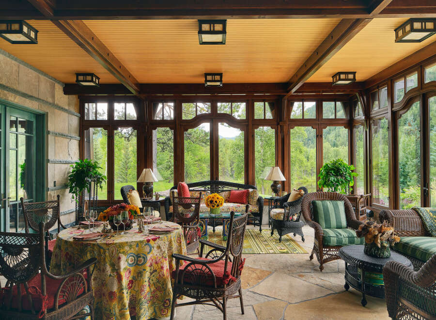 Step into a world of refined elegance with this stunning sunroom, offering a seamless blend of indoor comfort and outdoor beauty.