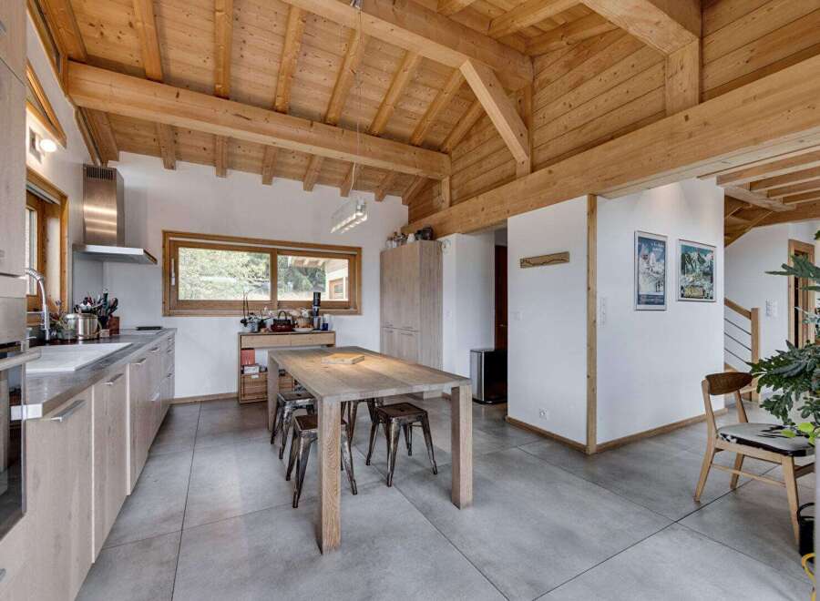 This stunning property boasts a beautifully designed kitchen with a wooden ceiling, creating a warm and inviting atmosphere.