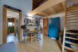 Discover this charming property featuring a cozy study area with a desk and shelving, perfect for work or hobbies.