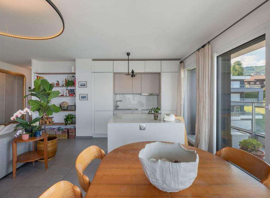 Experience modern living in this stunning property, featuring a bright and airy open-plan kitchen and dining area.