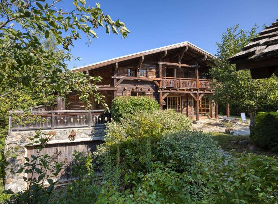 Discover the charm of this stunning wooden chalet, nestled amidst lush greenery.