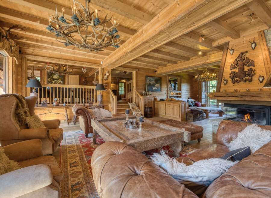 Experience rustic luxury in this stunning chalet-style living room.