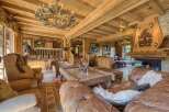 Experience rustic luxury in this stunning chalet-style living room.