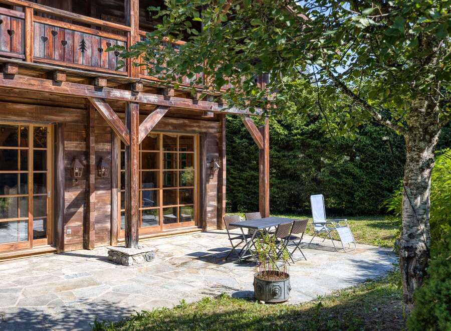 This charming wooden chalet offers a serene outdoor space, perfect for relaxation and entertaining.
