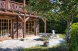 This charming wooden chalet offers a serene outdoor space, perfect for relaxation and entertaining.