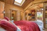 Experience rustic luxury in this stunning bedroom.