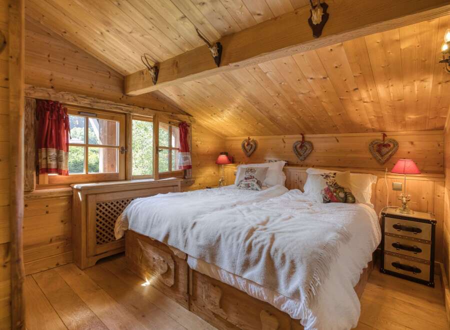 Step into a cozy bedroom retreat with a rustic charm.