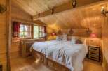 Step into a cozy bedroom retreat with a rustic charm.
