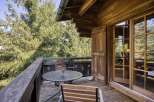 Enjoy the tranquility of this charming wooden balcony, perfect for relaxing and taking in the surrounding natural beauty.