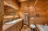 This rustic bathroom features beautiful wooden paneling, creating a warm and inviting atmosphere.