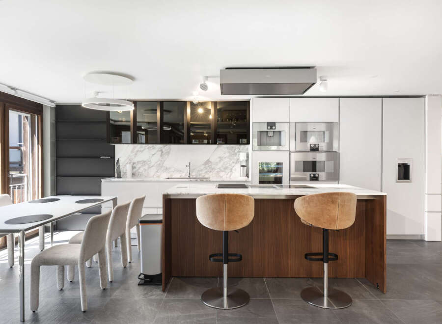 This modern kitchen boasts a sleek design with high-end appliances and a spacious island.
