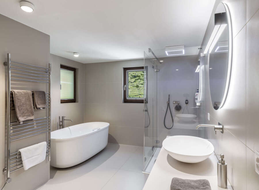 Step into a luxurious bathroom oasis, featuring a sleek, modern design.