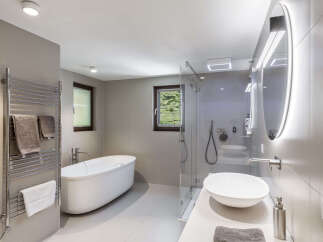 Step into a luxurious bathroom oasis, featuring a sleek, modern design.
