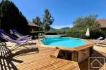 Enjoy the ultimate relaxation in this stunning property featuring a private pool and a spacious wooden deck.