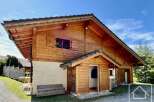 Discover this charming wooden chalet nestled in a serene environment.