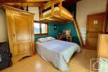 Discover this charming property featuring a cozy bedroom with a unique loft bed design.