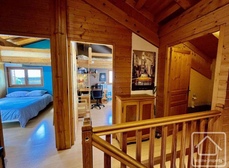 This charming property features a cozy interior with wooden accents throughout, creating a warm and inviting atmosphere.