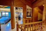 This charming property features a cozy interior with wooden accents throughout, creating a warm and inviting atmosphere.