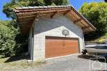Discover this charming property featuring a unique garage with a basketball hoop, perfect for recreational activities.