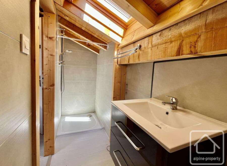 This stunning bathroom features a modern design with a touch of rustic charm.