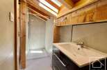 This stunning bathroom features a modern design with a touch of rustic charm.