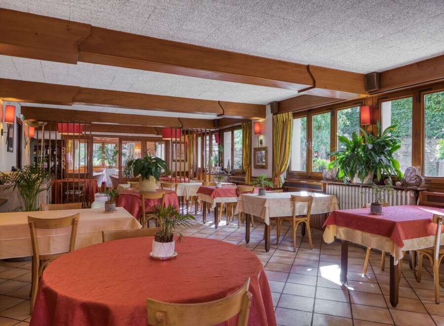 Step into a charming restaurant with a warm and inviting atmosphere.