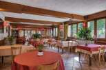 Step into a charming restaurant with a warm and inviting atmosphere.