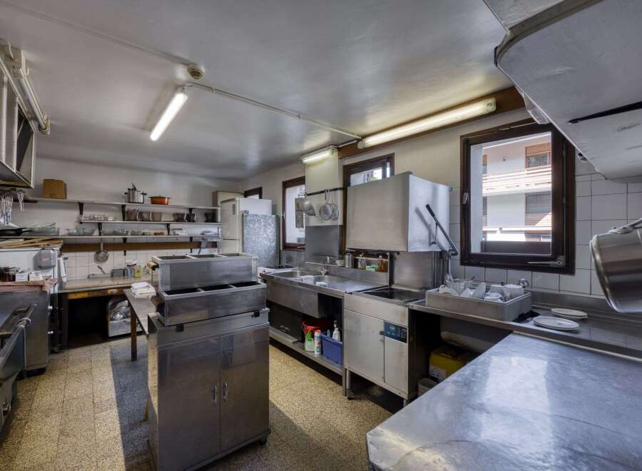 This commercial kitchen offers a functional and efficient workspace for culinary operations.
