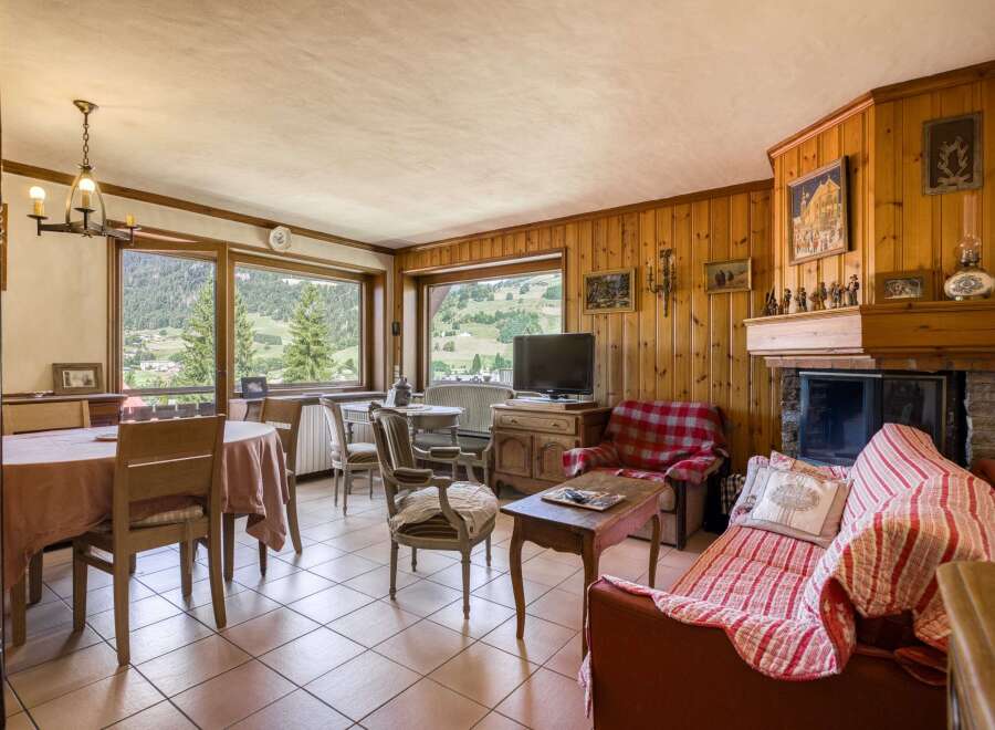 This charming living space features a cozy fireplace, perfect for relaxing evenings.